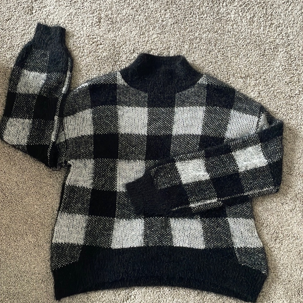 Black and white checked knit turtle neck sweater